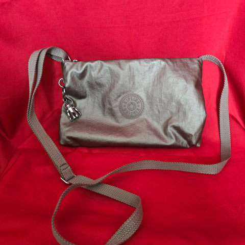 Kipling Grey Metallic Crossbody Bag with Adjustable Shoulder Strap.