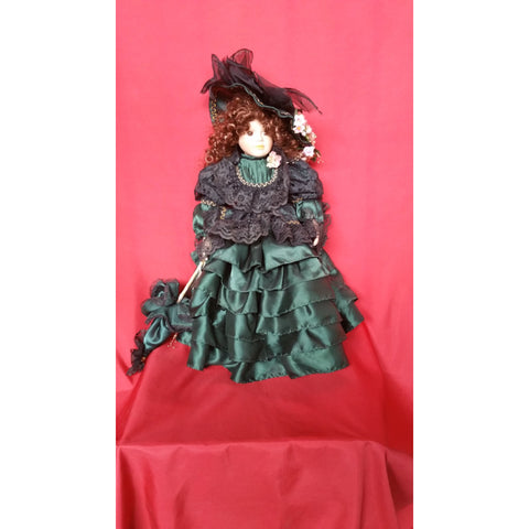 Porcelain doll with victorian style dress